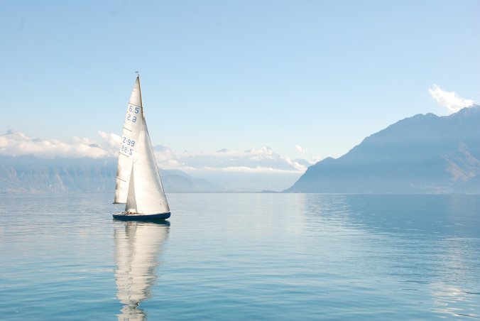 Visual of a boat in serene water to show God's help through - Post COVID-19 season.