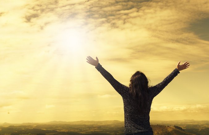 A visual of a lady with upraised hands seeking to become a person of God's choice.